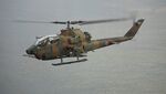 JGSDF AH-1S(73455) take off at Asia and The Pacific Ocean Trade Center March 10, 2013 02.jpg