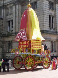 A Jagannath ratha with the abstract circular icon for Krishna at Chamberlain Square UK.jpg