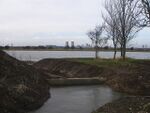 A man made channel leads to a shallow lake - geograph.org.uk - 1133835.jpg
