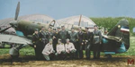 Pilots from 51st air group of the Sixth fighter regiment next to Yugoslav IK-3 fighter plane.png