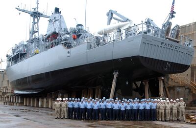 US Navy 040520-N-2420K-001 The crew of mine countermeasures ship USS Patriot (MCM 7) poses for a command photo during a dry dock maintenance period.jpg