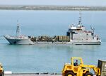 US Navy 100301-N-2000D-010 Army Landing Craft Unit (LCU) 2031 transports vehicles from USS Carter Hall (LSD 50).jpg