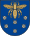 A coat of arms depicting a golden scarab with wings and legs outstretched flying over six purple flowers all on a blue background