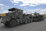 Transport heavy equipment carries an M60 Patton Tank at the National Guard Armory in Bluffton, Ind., June 30, 2009..jpg