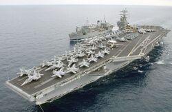030117-N-9851B-027 USS Harry Truman alongside Military Sealift Command ship USNS Spica (T-AFS 9).jpg