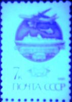 The Soviet Union 1991 CPA 6299 stamp under 254nm UV (14th standard issue of Soviet Union. 3rd issue. Modern Mail Transport. Mail truck, train, ocean liner, Ilyushin Il-86 jetliner and Mil Mi-2 helicopter).jpg