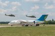 Pair of Ukrainian AF Mil Mi-24P flying over Ukrainian Govt An-148-100V at Chuguyev.jpg