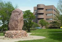 Shunganunga Boulder with City Hall.JPG