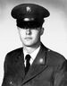 A black and white image showing the head and upper torso of Sasser wearing his military dress uniform with ribbons.