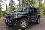 2011 jeep wrangler propped on wood stacks.jpg