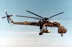 Sikorsky Skycrane carrying parachute bomb c.jpg