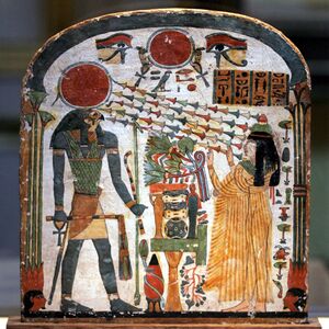 Painted wood panel showing a woman with arms upraised toward a man with a falcon’s head and a sun-disk crown. Chains of flowers-like shapes radiate from the disk toward the woman’s face.