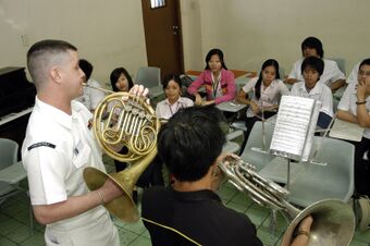US Navy 070209-N-2746N-111 Musician 2nd Class Robert Booker, assigned to the 7th Fleet Band, instructs Karlo Espirito of the University of Santo Tomas Conservatory of Music.jpg