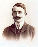 ЖабагӀа Ийже Висангири, финансий министр, гӀалгӀа хиннав. Лоамарой Республика декларация язъяри, цун Консититуци язъечарна юкъера цаӀи хиннав. Социолог, публицист хиннав. 1962 шера Истмале дӀаваьннав, эмиграце волаш.
