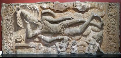 A sculpture of sleeping Vishnu Hindu deity at Museum CSMVS Mumbai.jpg