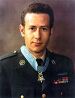 A color image showing Penry from the waist up in his military dress uniform with ribbons. His Medal of Honor is visible around his neck.