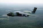 A left side view of a C-5A Galaxy aircraft in flight near Pope Air Force Base, North Carolina - DPLA - 0e6d8226c47acd53e9500d1e4a7109f3.jpeg