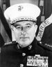 A black and white image of Raymond Davis, a white male in his Marine Corps dress uniform