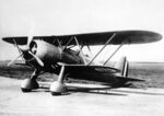Fiat CR 42 Falco fighter parked.jpg