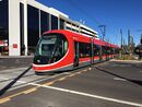 Urbos 3 departing Alinga Street light rail stop.jpg