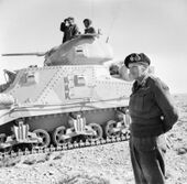 General Montgomery stands beside a Grant command tank near Tripoli, 27 January 1943. E21701.jpg