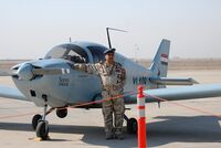 An Iraqi air force pilot with a CH2000 reconnaissance plane.jpg
