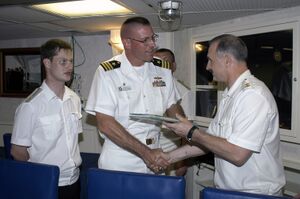 US Navy 060327-N-4658L-115 Vice Adm. Konstantin Sidenko, presents a Russian Pacific Fleet photo book to USS Chung-Hoon (DDG 93) Commanding Officer, Cmdr. Dave Welch.jpg