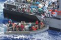 Distressed persons are transferred to a Maltese patrol vessel..jpg