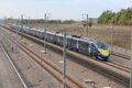 Class 395 train passes through the depot, coast bound.jpg