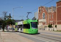 Oklahoma City Streetcar - green car on 4th Street passing First United Methodist Church.jpg