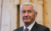 Турбьёрн Ягланд крупно в костюме.webp